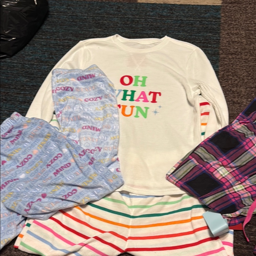 Pajama set. Two pair of pants and one set
Youth XL and one adult XS